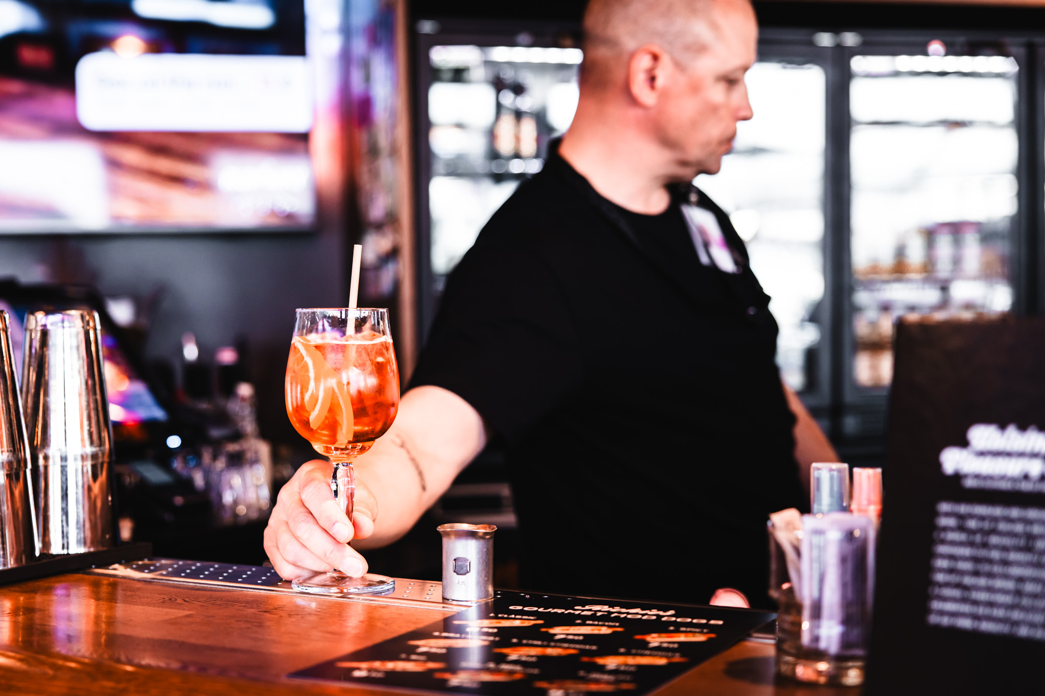 Bartender presenting a cocktail