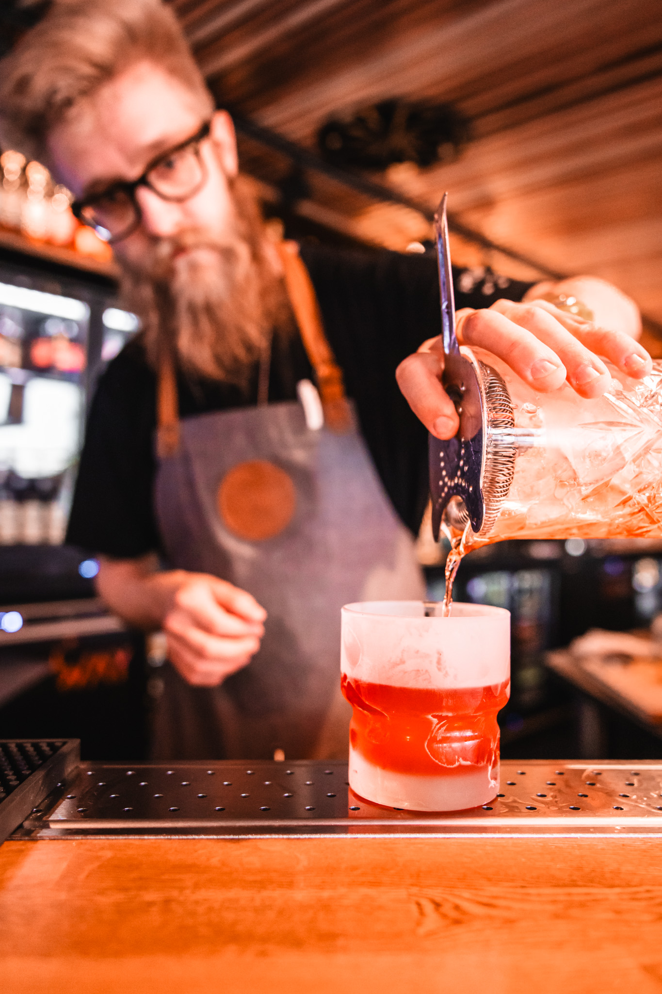 Layered cocktail being poured