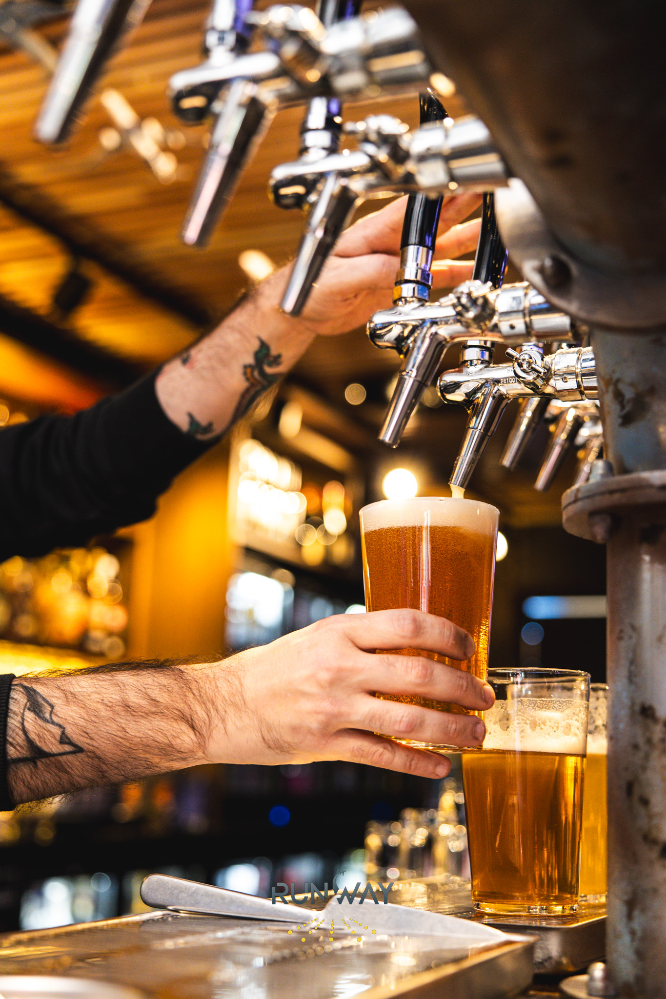 Draft beer pulled from chrome taps